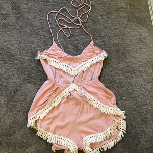 Pink romper with whites tassels